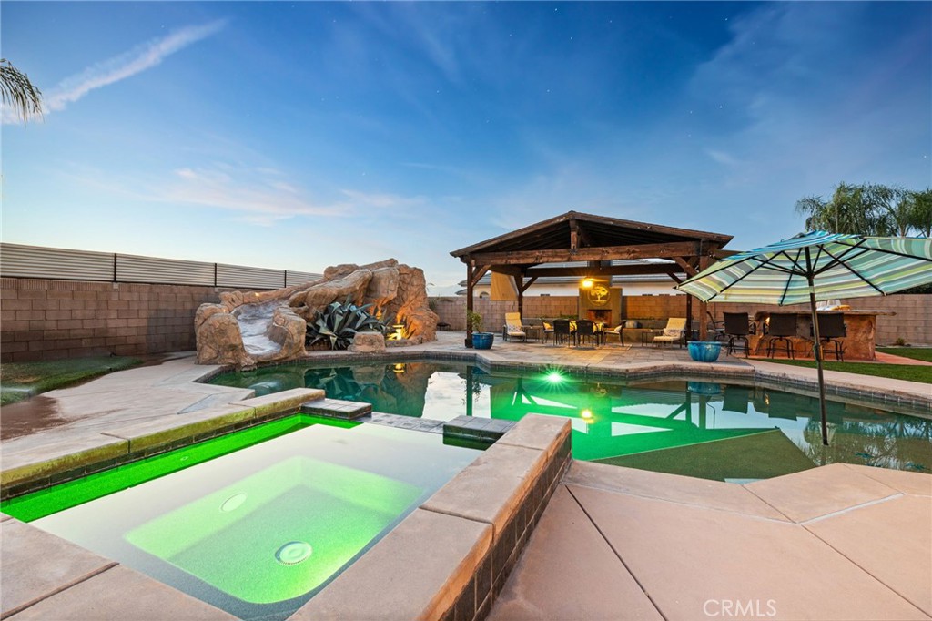 26487 Thacker Drive Hemet, CA 92544 - Photo 19 of 60 a view of a swimming pool with a patio
