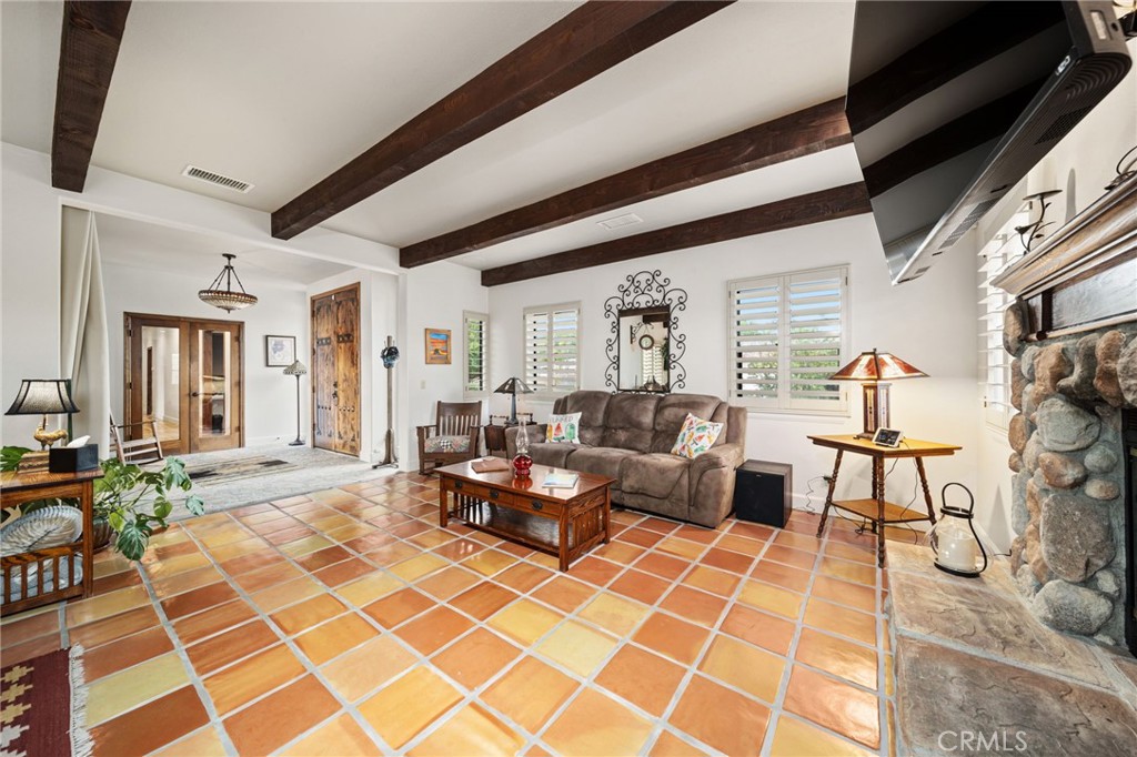 26487 Thacker Drive Hemet, CA 92544 - Photo 27 of 60 a living room with furniture and a rug