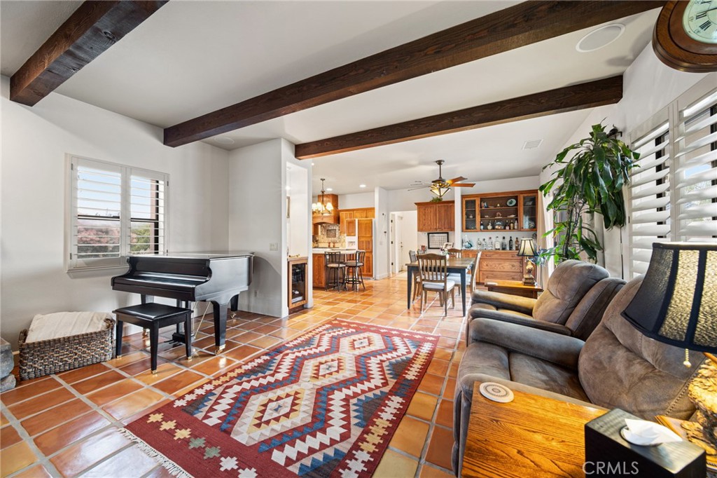 26487 Thacker Drive Hemet, CA 92544 - Photo 29 of 60 a living room with furniture a rug and a table
