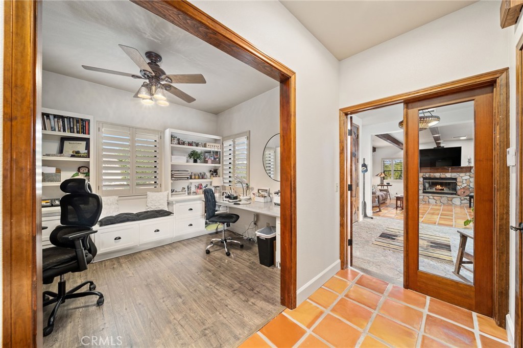 26487 Thacker Drive Hemet, CA 92544 - Photo 38 of 60 a view of a hardwood floor and a ceiling fan in a room