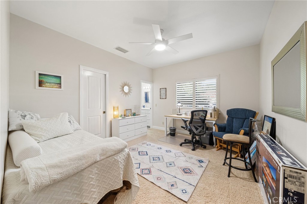 26487 Thacker Drive Hemet, CA 92544 - Photo 47 of 60 a bedroom with furniture and a large window