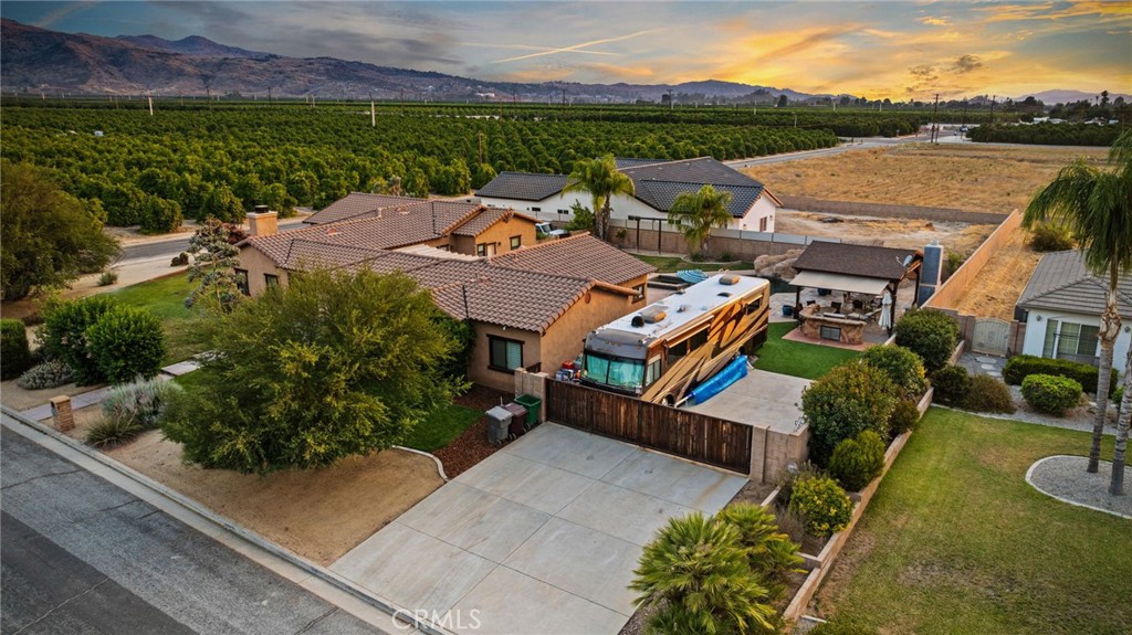 26487 Thacker Drive Hemet, CA 92544 - Photo 5 of 60 an aerial view of a house with garden space and lake view