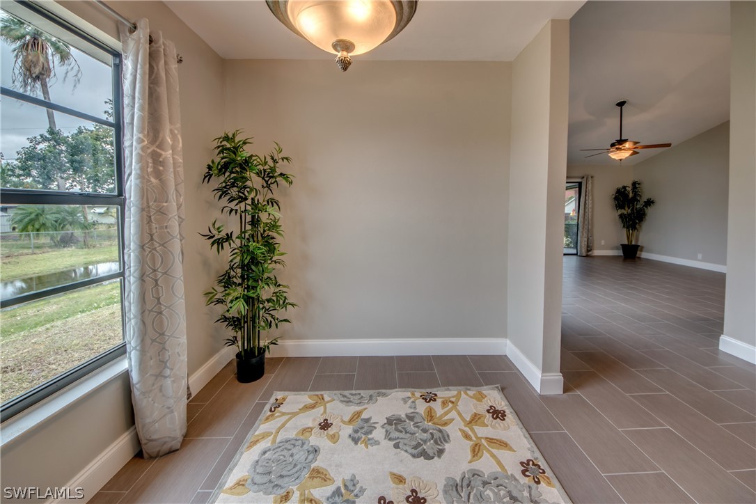 17520 Oriole Road Fort Myers, FL 33967 - Photo 11 of 25 a room with a potted plant and a rug