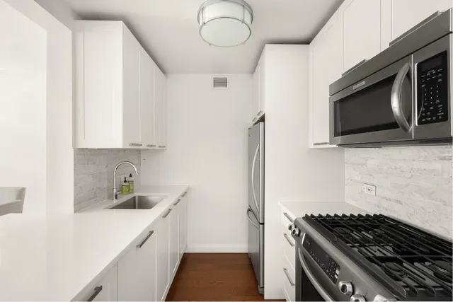 a kitchen with a stove and a microwave