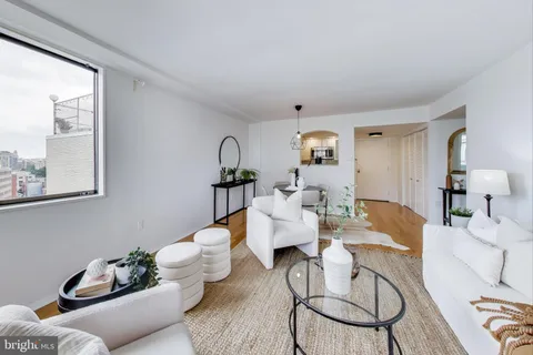 a living room with furniture and window