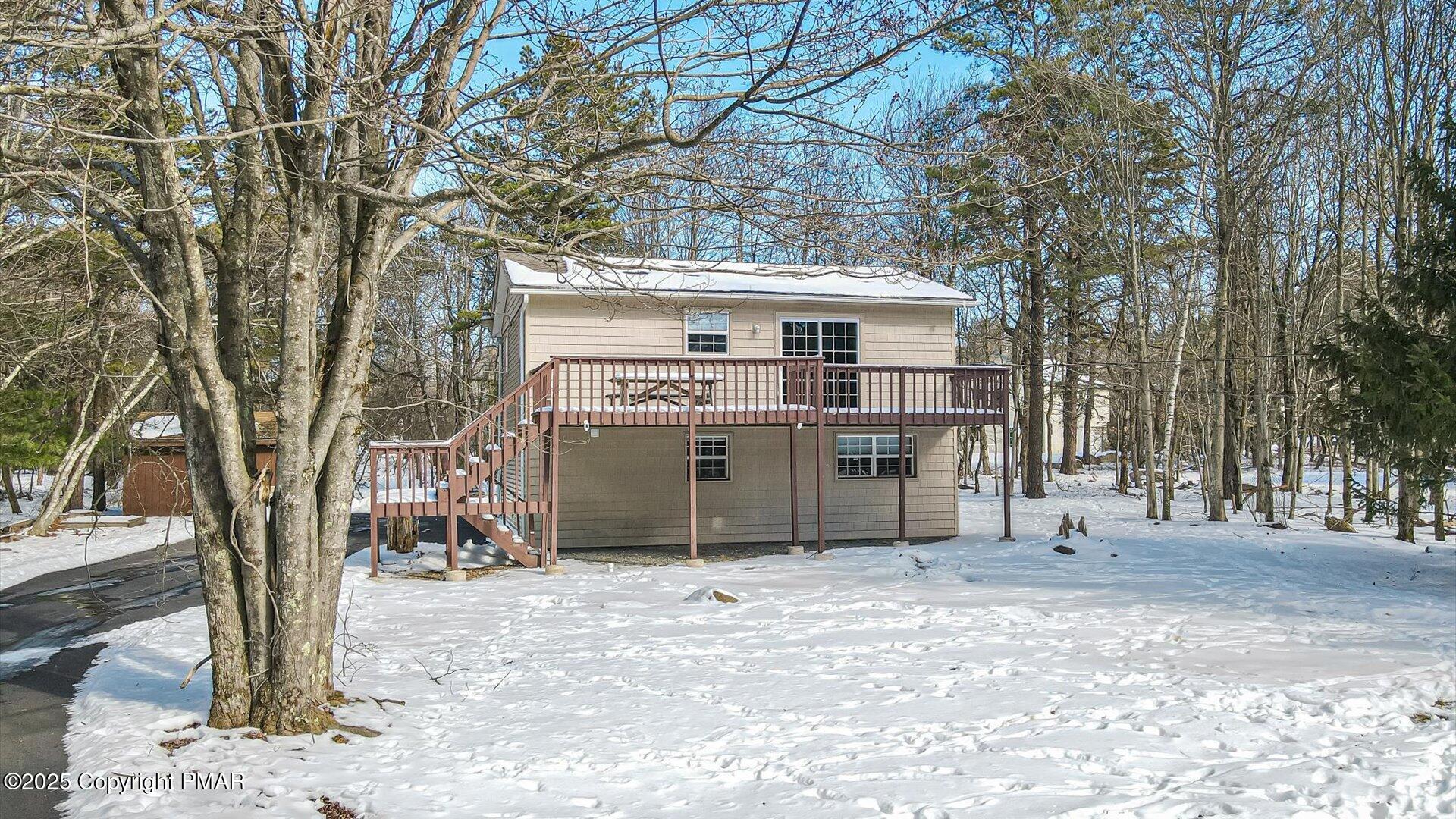 277 Fern Ridge Road Blakeslee, PA 18610 - Photo 1 of 46 a house with a tree in front of it