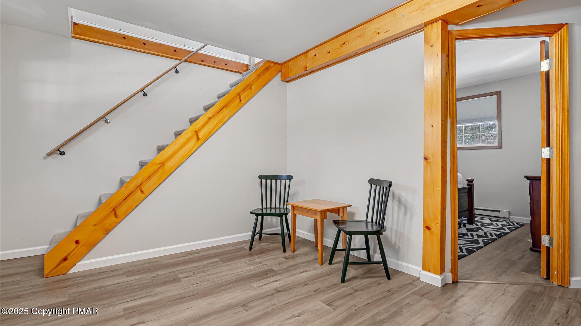 277 Fern Ridge Road Blakeslee, PA 18610 - Photo 18 of 46 a room with wooden floor and furniture