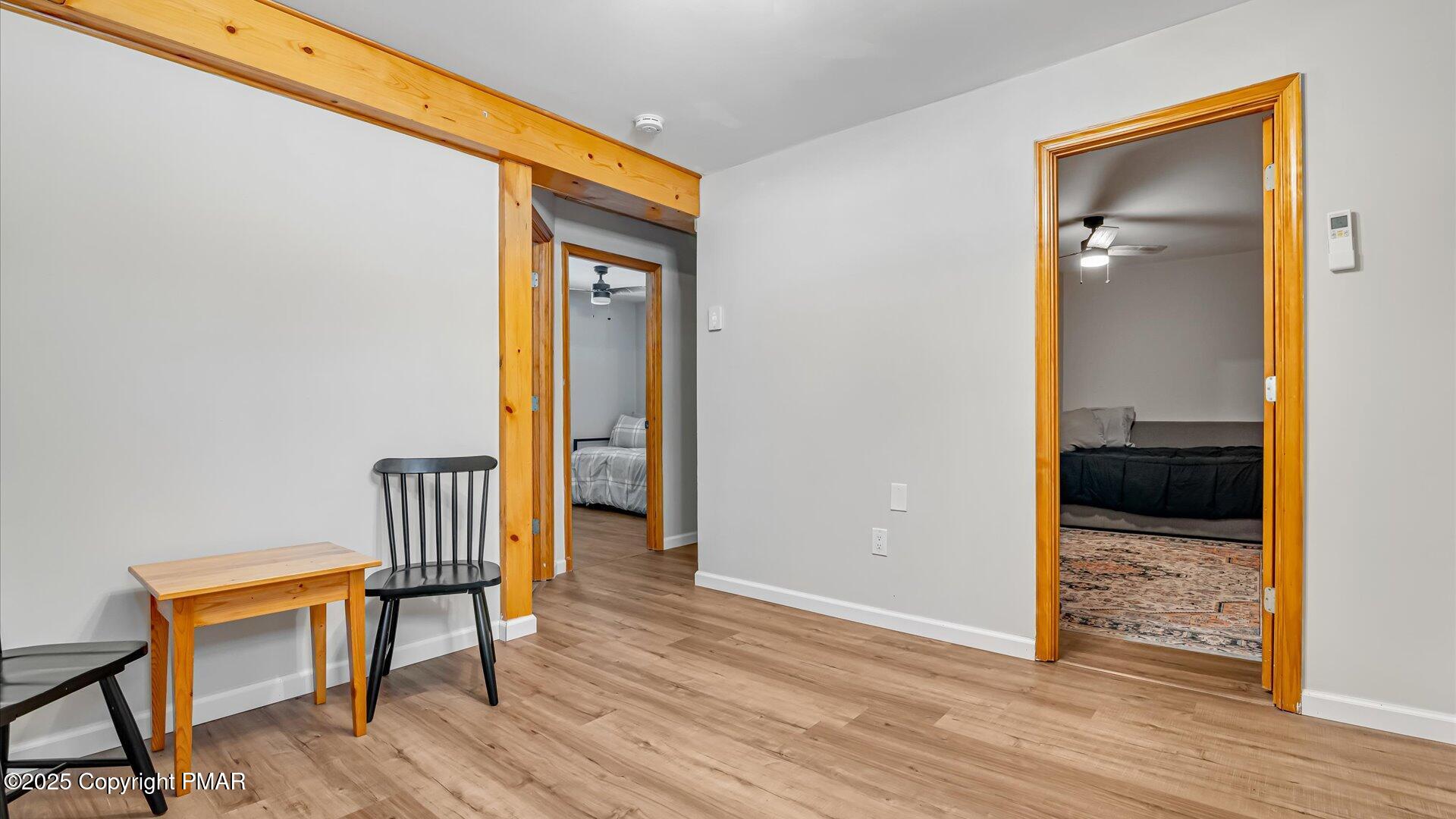 277 Fern Ridge Road Blakeslee, PA 18610 - Photo 19 of 46 a view of a hallway and wooden floor and a dining room
