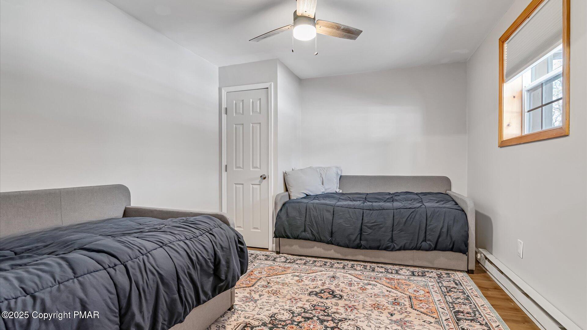 277 Fern Ridge Road Blakeslee, PA 18610 - Photo 20 of 46 a bedroom with a bed and a dresser