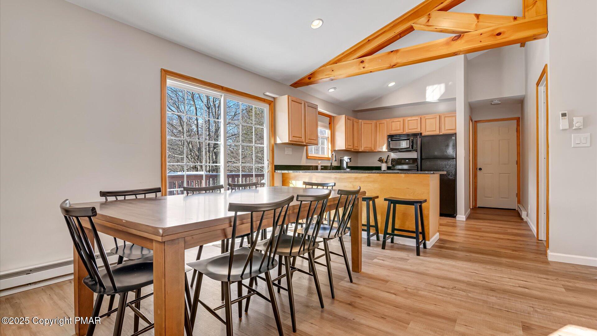 277 Fern Ridge Road Blakeslee, PA 18610 - Photo 2 of 46 a view of a dining area with furniture and wooden floor