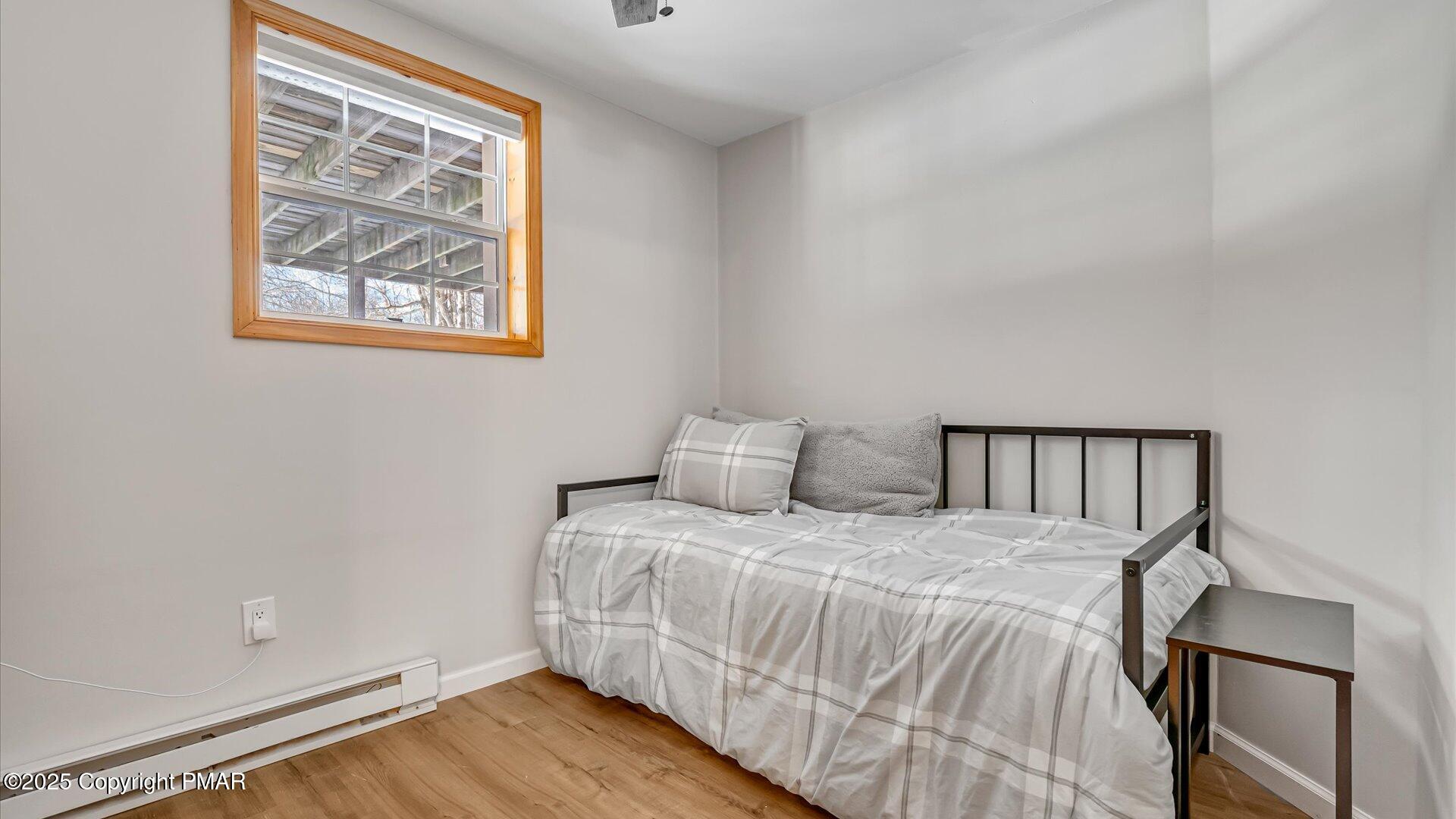277 Fern Ridge Road Blakeslee, PA 18610 - Photo 24 of 46 a bedroom with a bed and a window