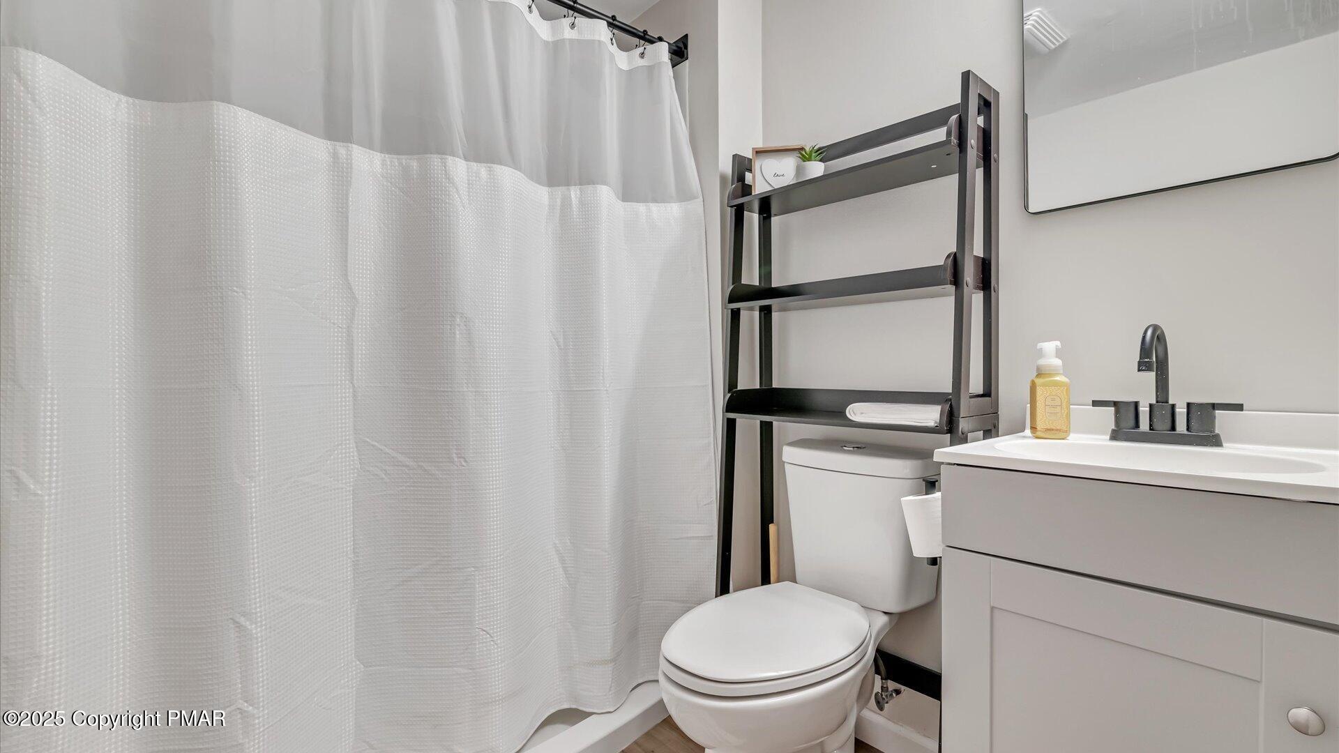 277 Fern Ridge Road Blakeslee, PA 18610 - Photo 26 of 46 a bathroom with a sink toilet and shower