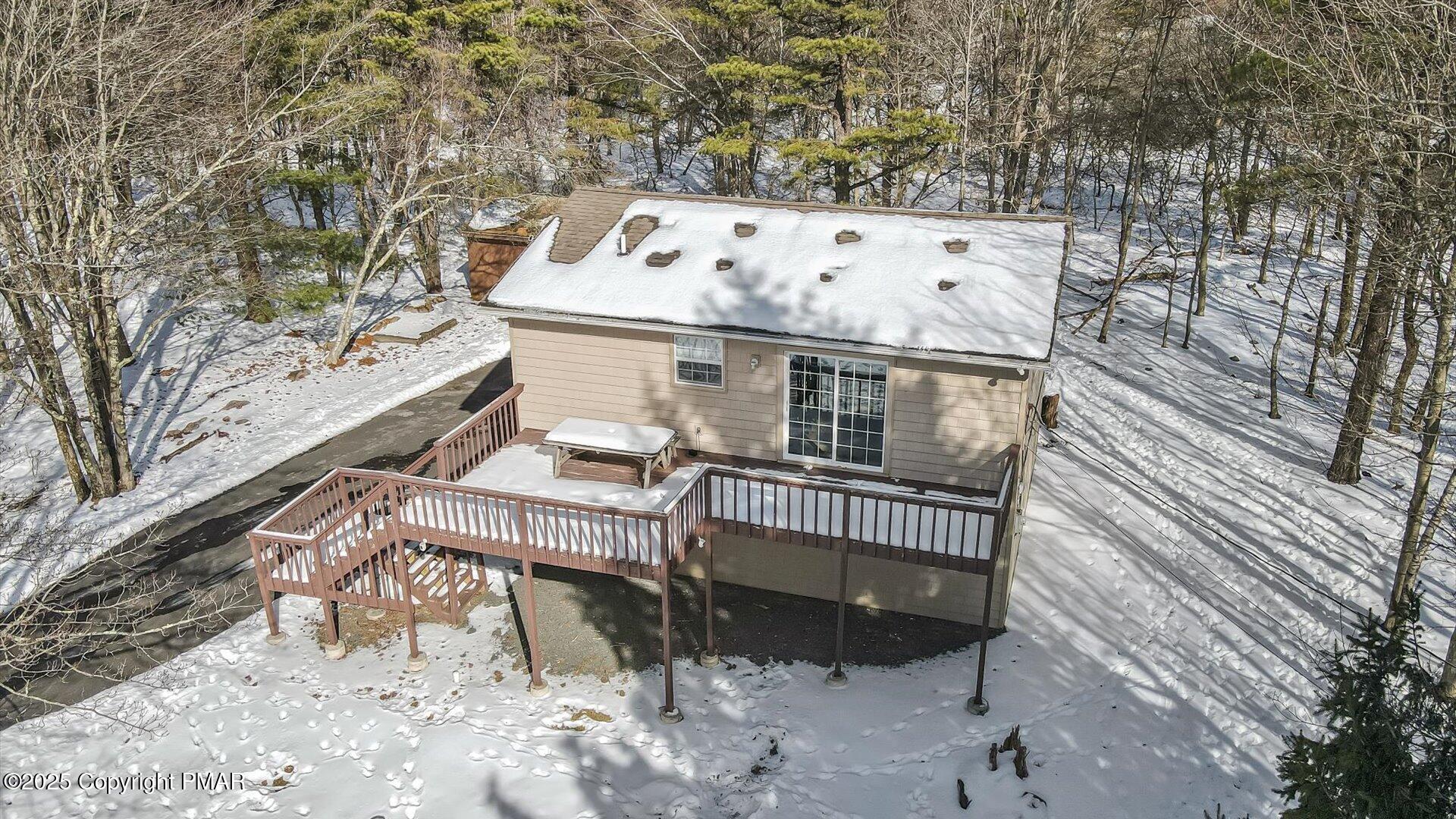 277 Fern Ridge Road Blakeslee, PA 18610 - Photo 29 of 46 a roof deck with table and chairs