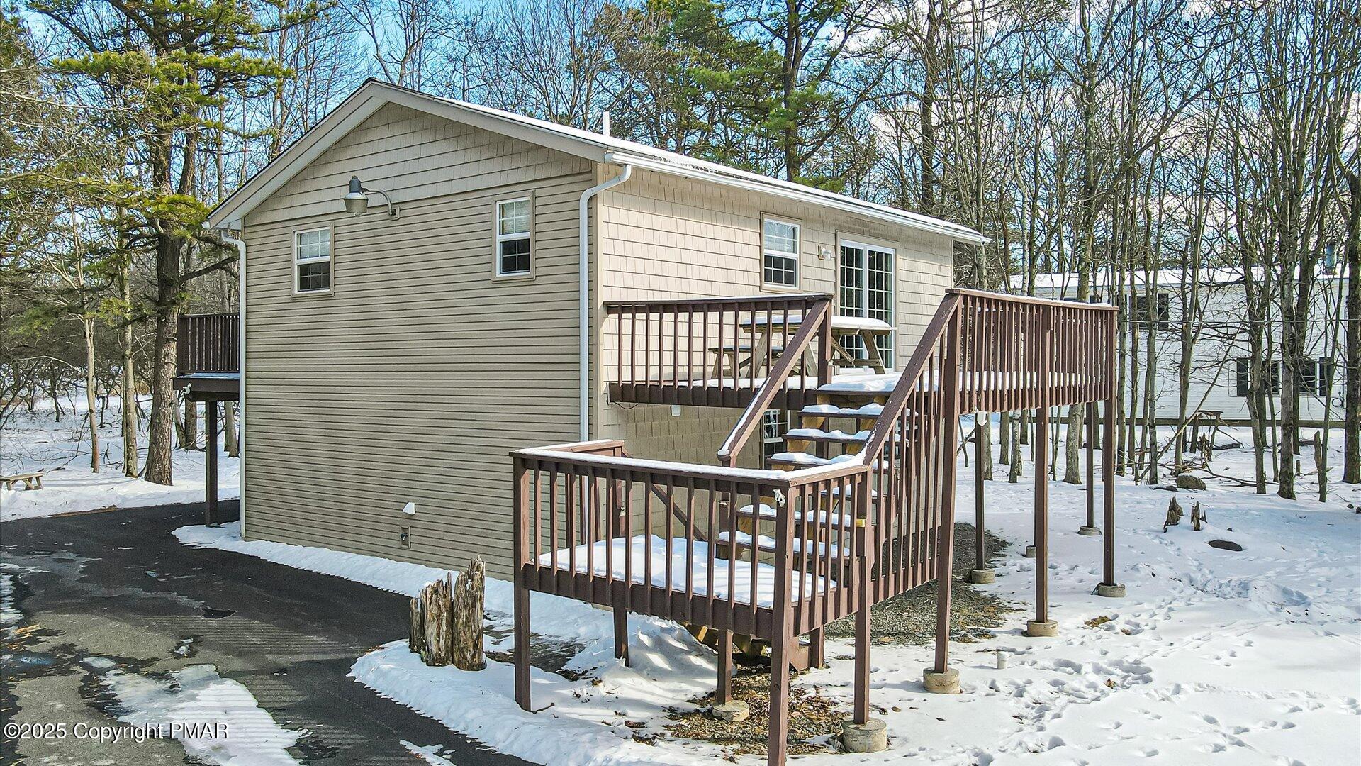 277 Fern Ridge Road Blakeslee, PA 18610 - Photo 31 of 46 a view of a house with a deck