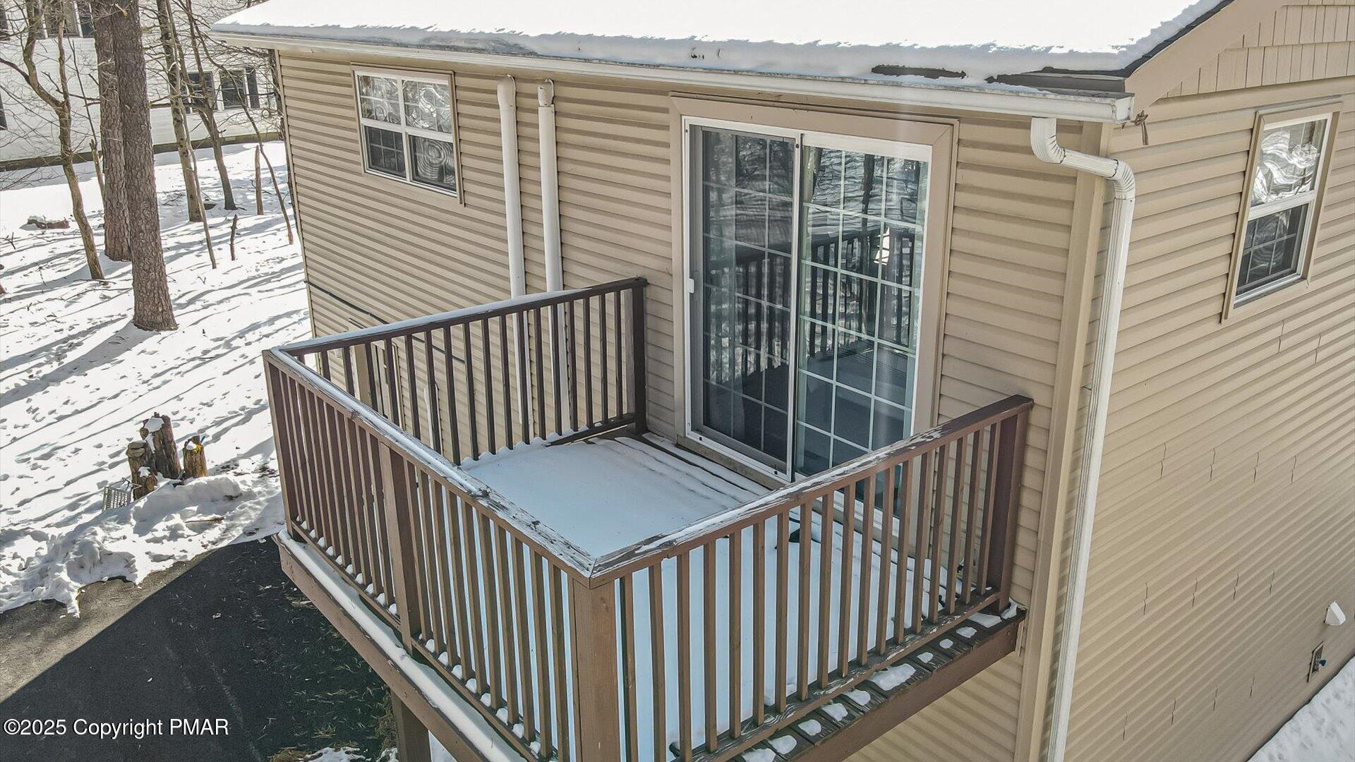 277 Fern Ridge Road Blakeslee, PA 18610 - Photo 34 of 46 a view of a balcony with wooden floor