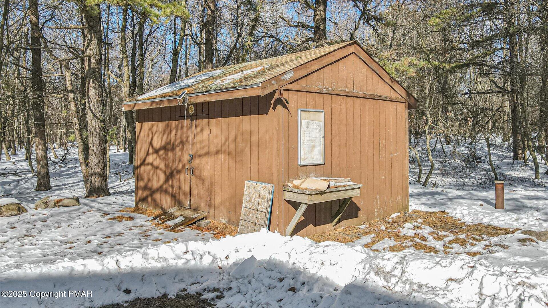 277 Fern Ridge Road Blakeslee, PA 18610 - Photo 35 of 46 a backyard of a house with table and chairs