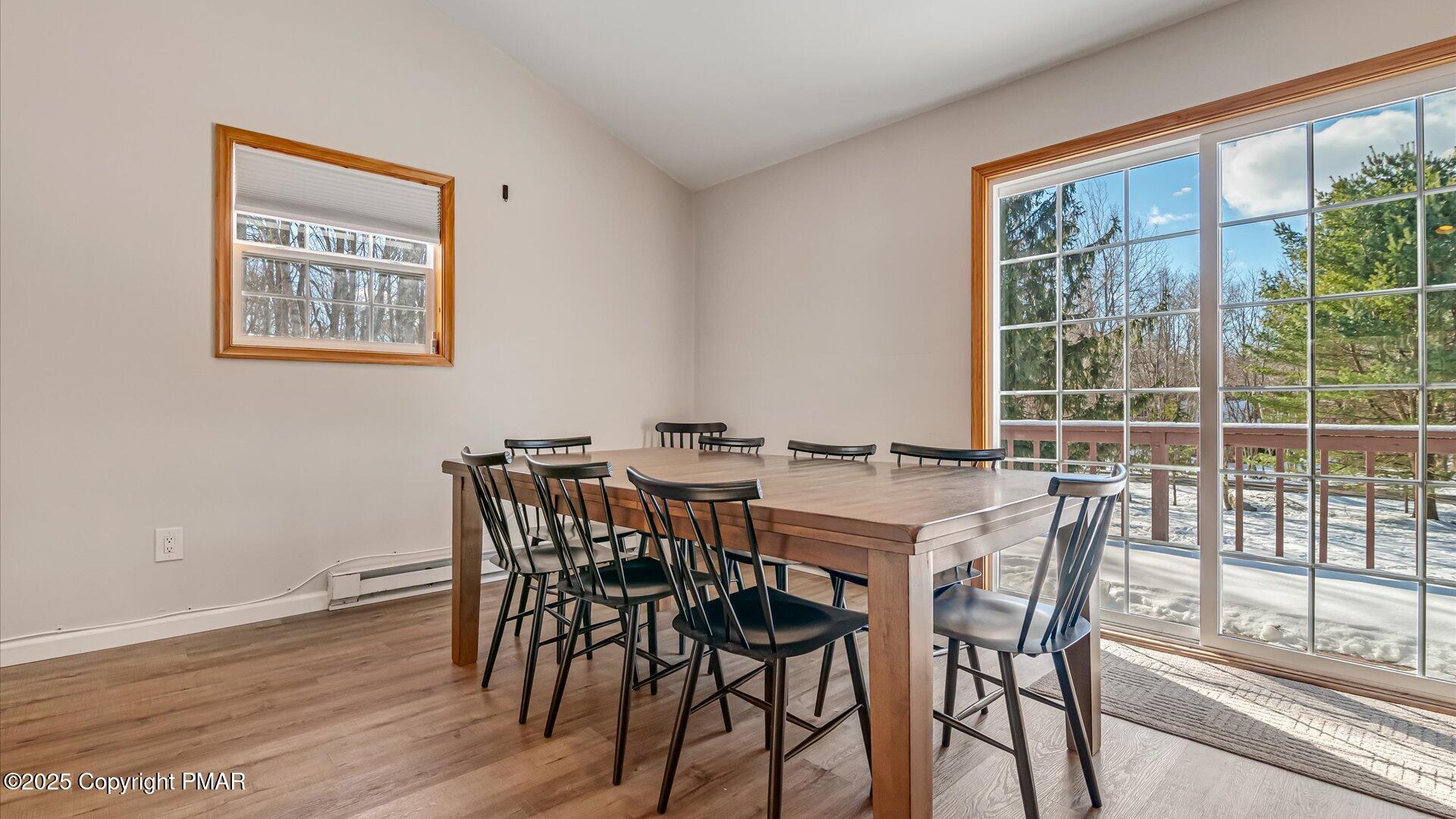 277 Fern Ridge Road Blakeslee, PA 18610 - Photo 8 of 46 a view of a dining room with furniture window and wooden floor