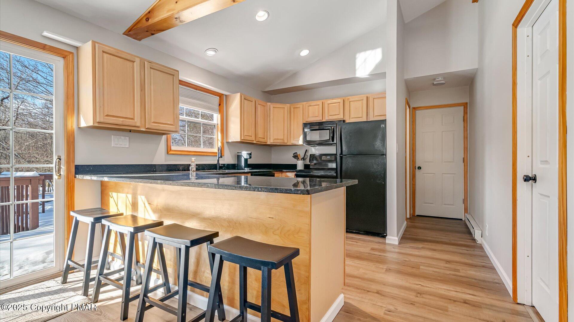 277 Fern Ridge Road Blakeslee, PA 18610 - Photo 9 of 46 a kitchen with stainless steel appliances granite countertop a refrigerator and a stove top oven