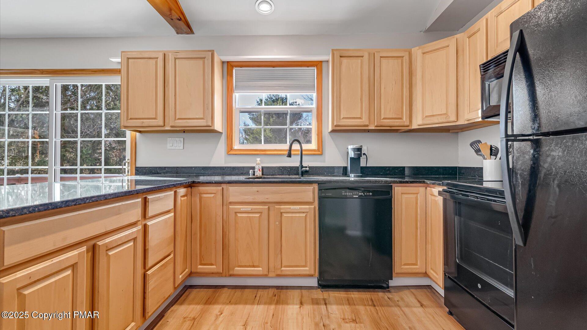 277 Fern Ridge Road Blakeslee, PA 18610 - Photo 10 of 46 a kitchen with granite countertop a refrigerator sink and cabinets