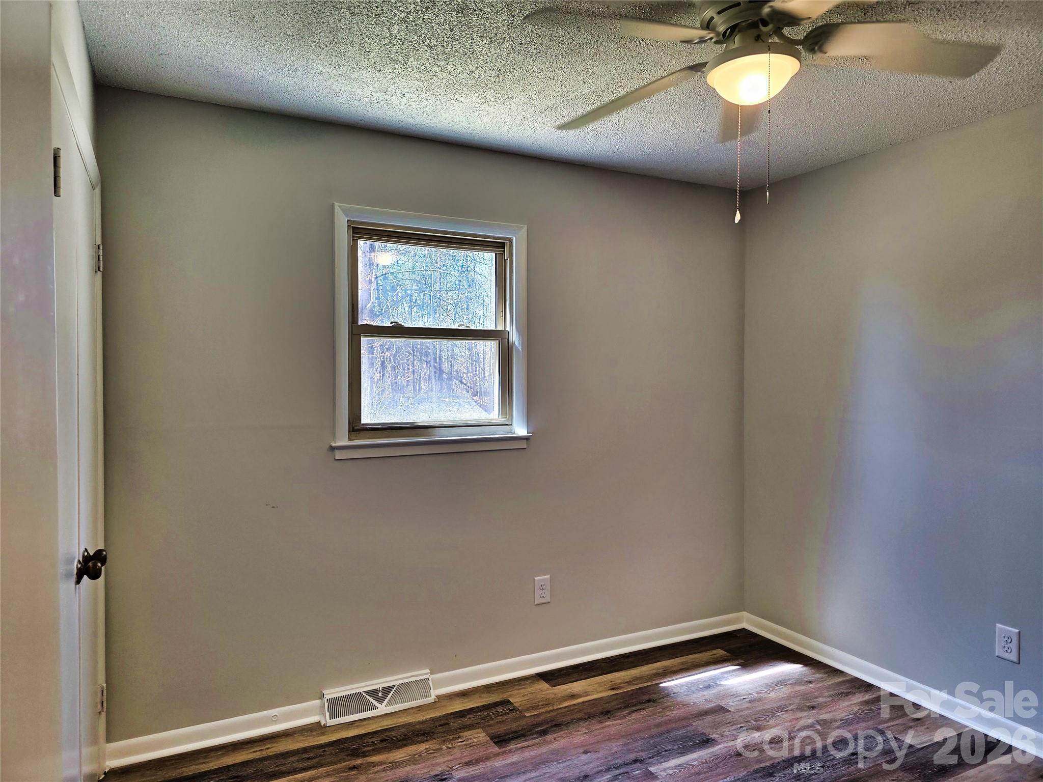 323 Mt Bethel Road Harmony, NC 28634 - Photo 16 of 25 an empty room with a window