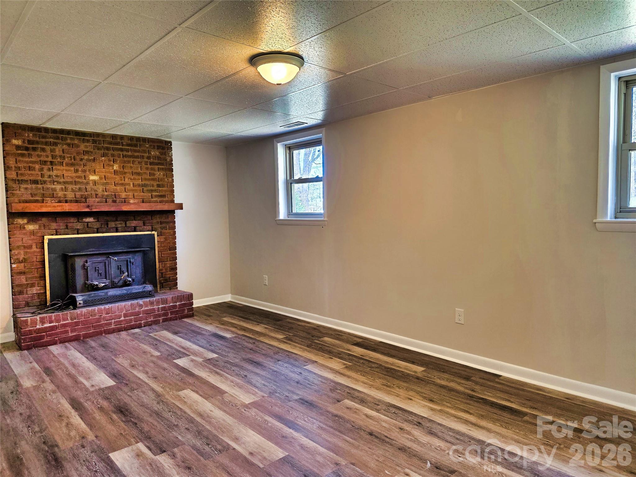 323 Mt Bethel Road Harmony, NC 28634 - Photo 19 of 25 an empty room with windows and fireplace