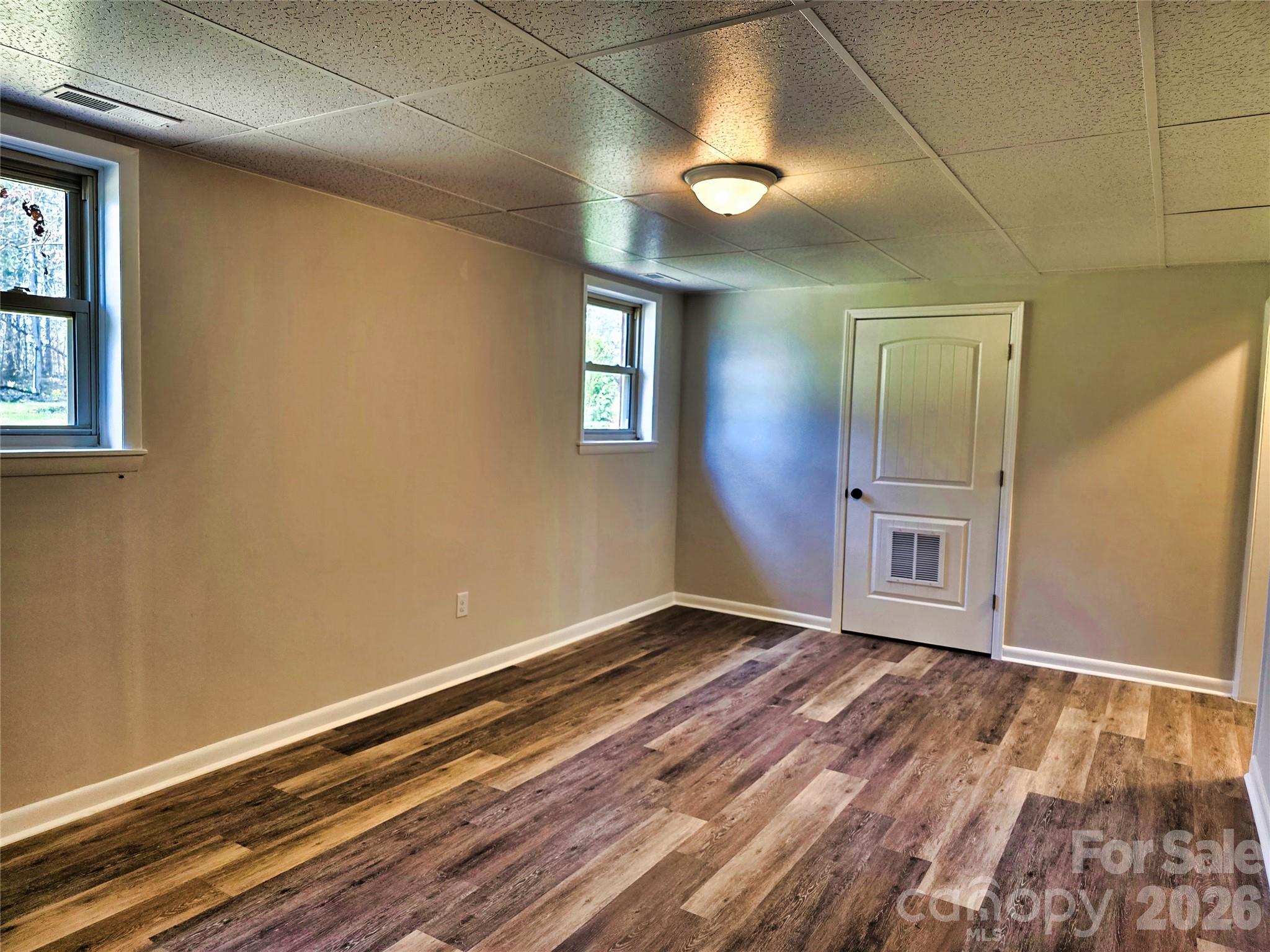 323 Mt Bethel Road Harmony, NC 28634 - Photo 20 of 25 a view of an empty room with window and wooden floor