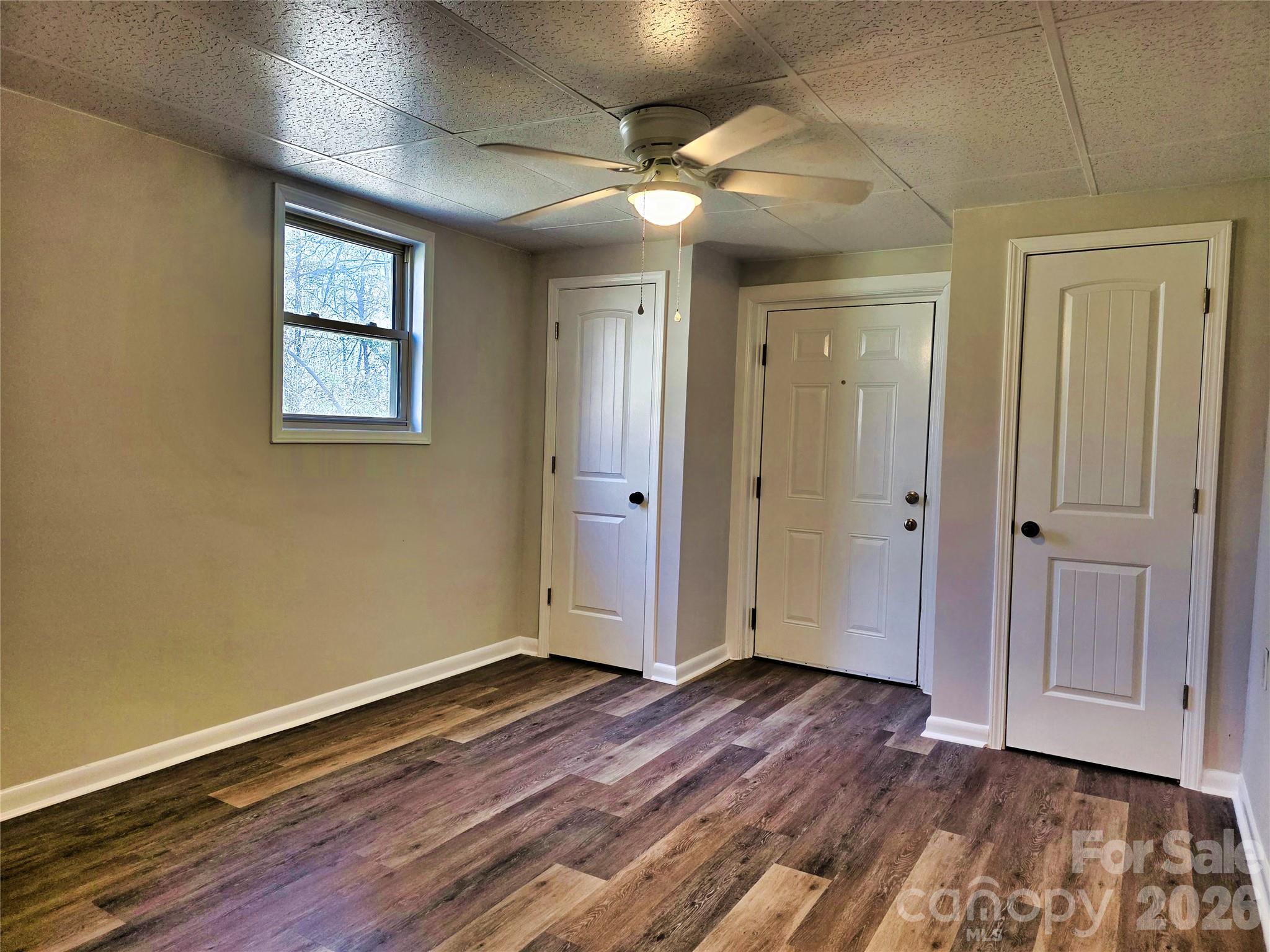 323 Mt Bethel Road Harmony, NC 28634 - Photo 21 of 25 a view of an empty room with wooden floor and a window