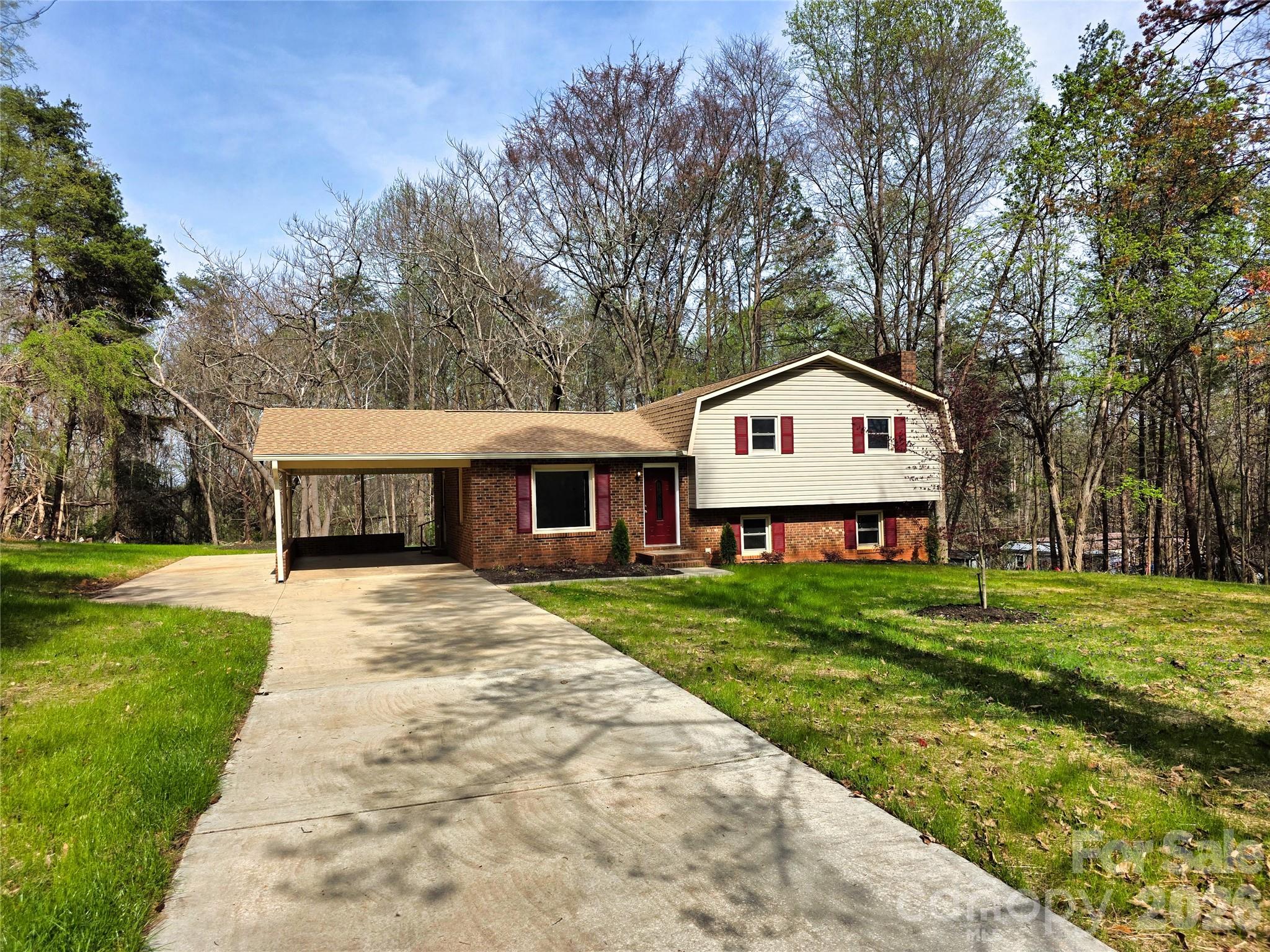 323 Mt Bethel Road Harmony, NC 28634 - Photo 3 of 25 a front view of a house with garden