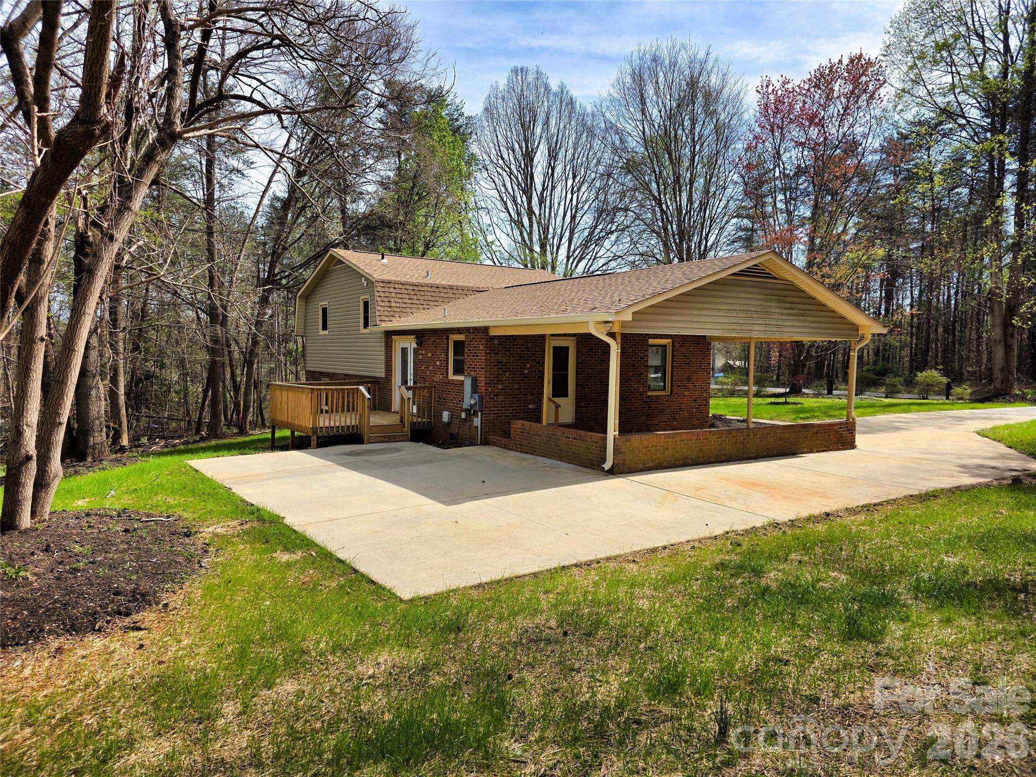323 Mt Bethel Road Harmony, NC 28634 - Photo 7 of 25 a front view of a house with a yard and trees
