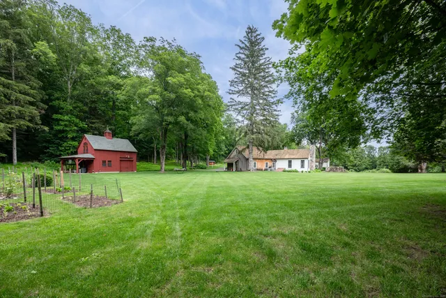 a view of a table and chairs in the garden