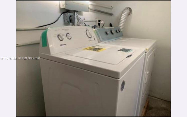 401 Southwest 8th Street, Unit A Hallandale Beach, FL 33009 - Photo 12 of 17 a utility room with dryer and washer