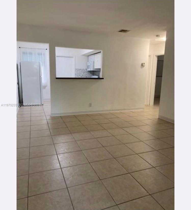 401 Southwest 8th Street, Unit A Hallandale Beach, FL 33009 - Photo 4 of 17 a view of a utility room and empty room