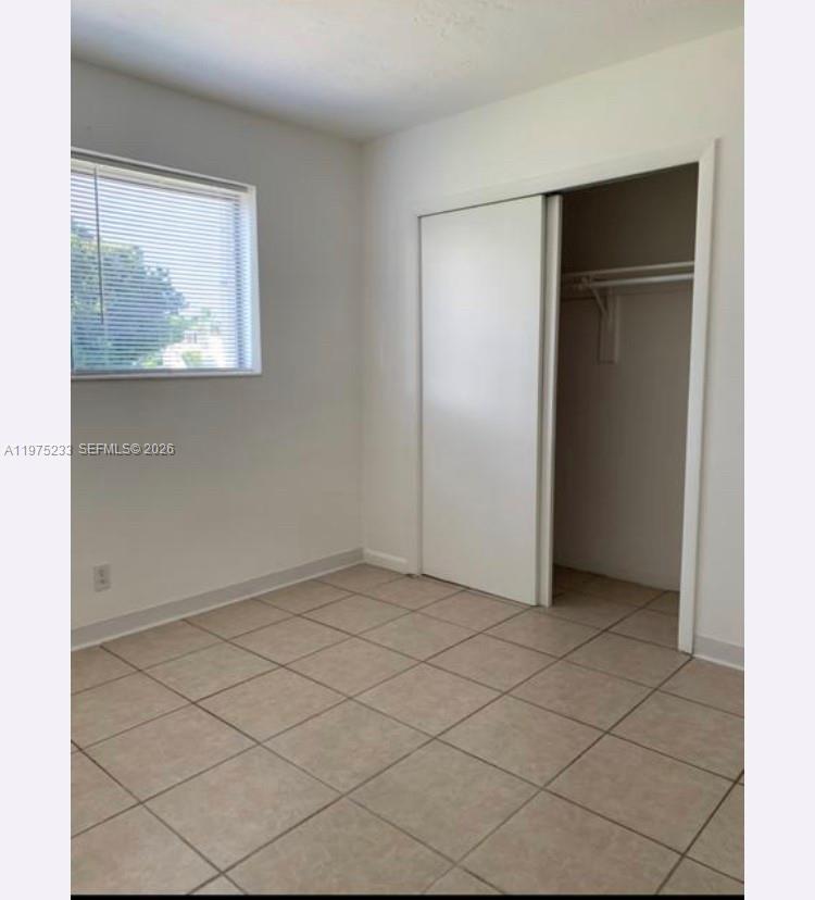401 Southwest 8th Street, Unit A Hallandale Beach, FL 33009 - Photo 8 of 17 a view of an empty room