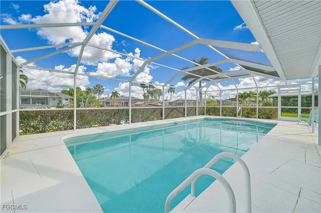 a view of a backyard with a swimming pool