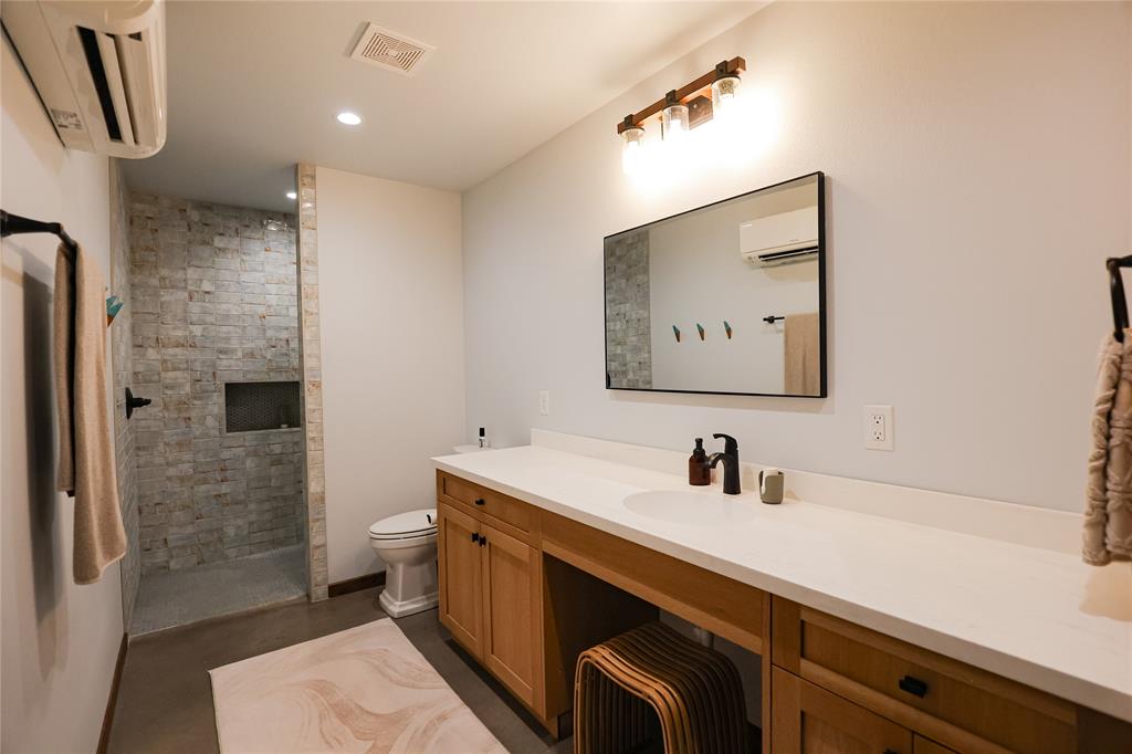 1250 County Road Brady, TX 76825 - Photo 19 of 40 a bathroom with a sink a toilet and shower