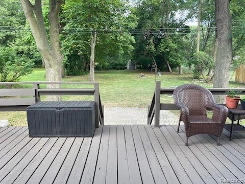 9552 Wayne Road Livonia, MI 48150 - Photo 23 of 31 View from the deck showcases the large, tree-lined backyard and generous outdoor space.