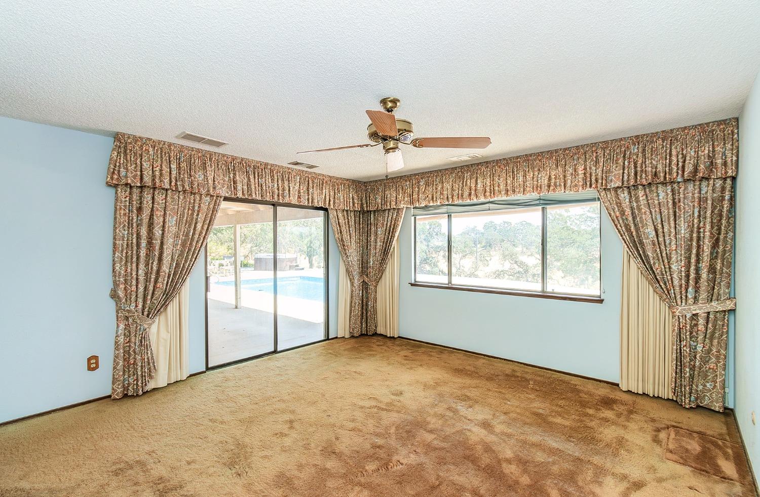 10574 Millerton Road Clovis, CA 93619 - Photo 12 of 36 a view of an empty room with a window