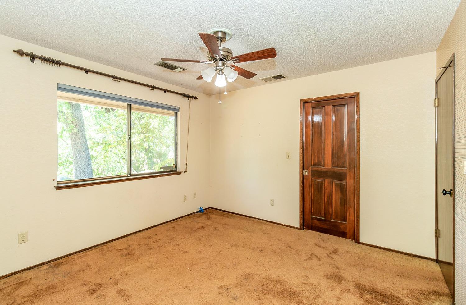 10574 Millerton Road Clovis, CA 93619 - Photo 18 of 36 a view of an empty room with a window