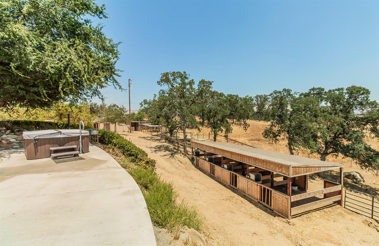 10574 Millerton Road Clovis, CA 93619 - Photo 25 of 36 a view of a swimming pool with a patio