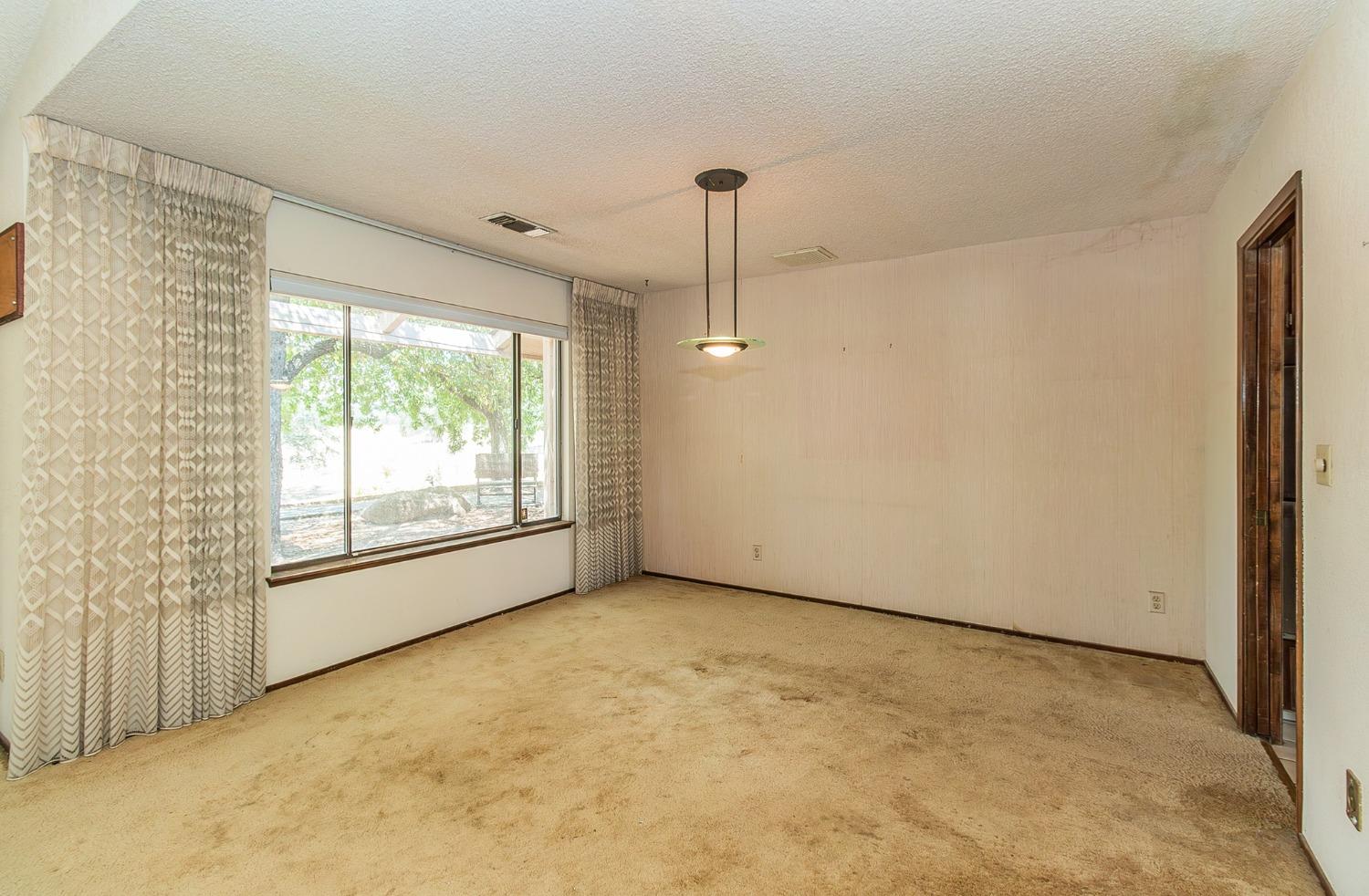 10574 Millerton Road Clovis, CA 93619 - Photo 4 of 36 a view of an empty room with a window