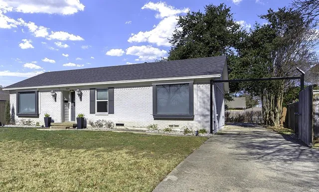 a front view of a house with a yard outdoor seating and yard