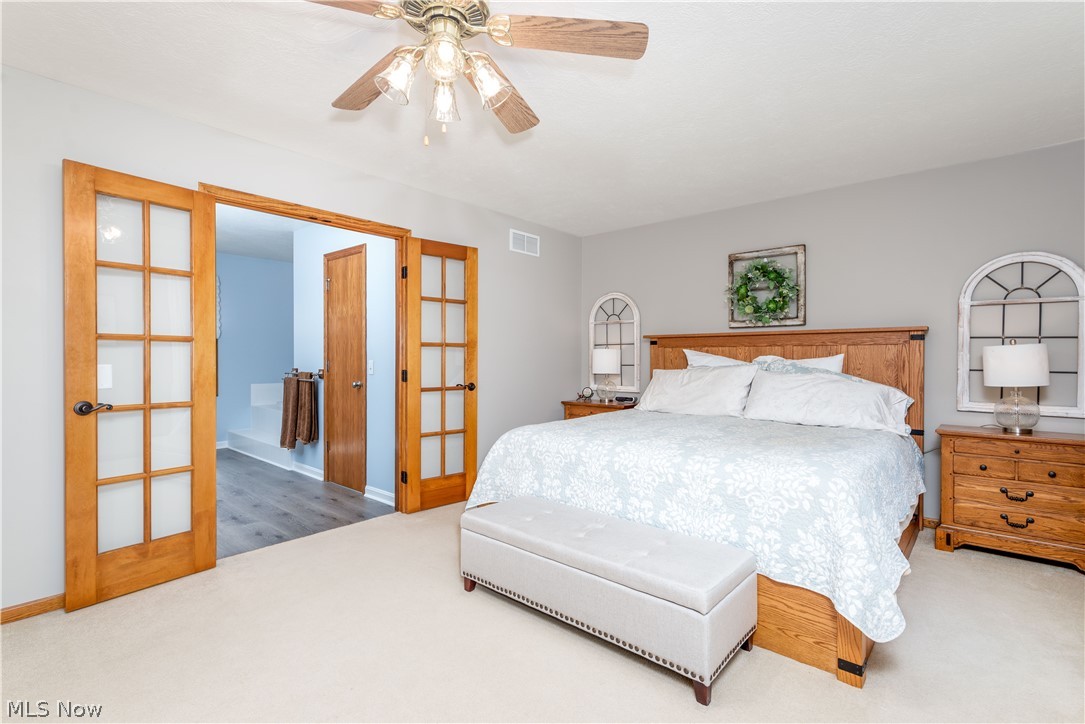 8666 Cooley Road Ravenna, OH 44266 - Photo 20 of 35 Master bedroom with french doors to master bath