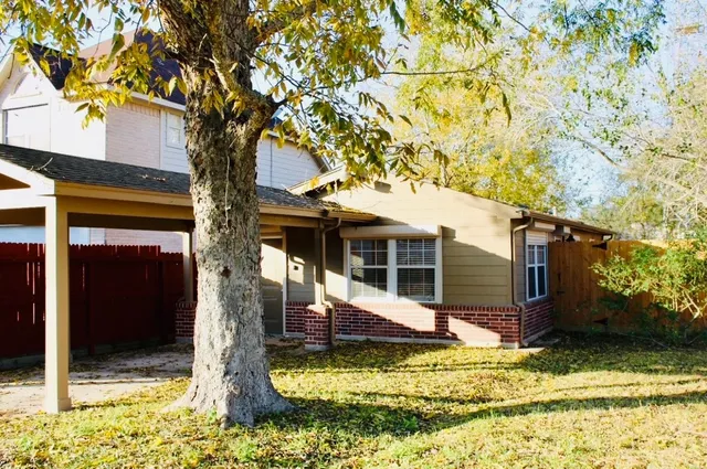 a view of house with yard