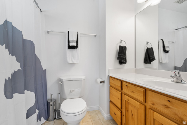 732 North 200 E Street Springville, UT 84663 - Photo 23 of 36 Bathroom featuring a single vanity with wood cabinetry, a white countertop, and a chrome faucet