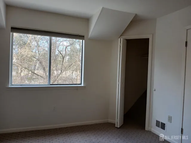 a view of a room that has a large window