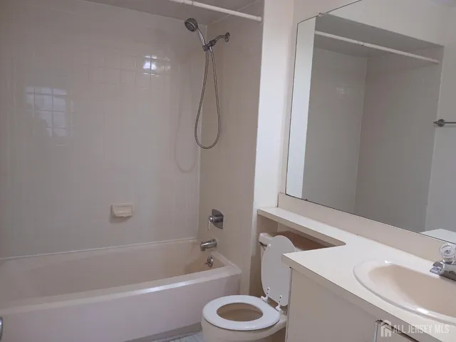 a bathroom with a sink a toilet and a bathtub