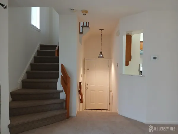 a view of entryway with wooden floor
