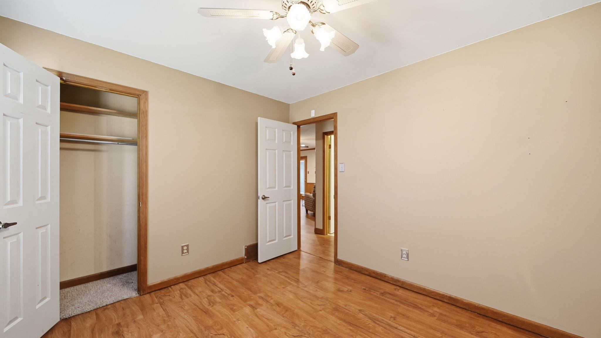 5069 Ross Road Memphis, TN 38141 - Photo 13 of 40 Unfurnished bedroom featuring light wood-type flooring, a closet, and ceiling fan