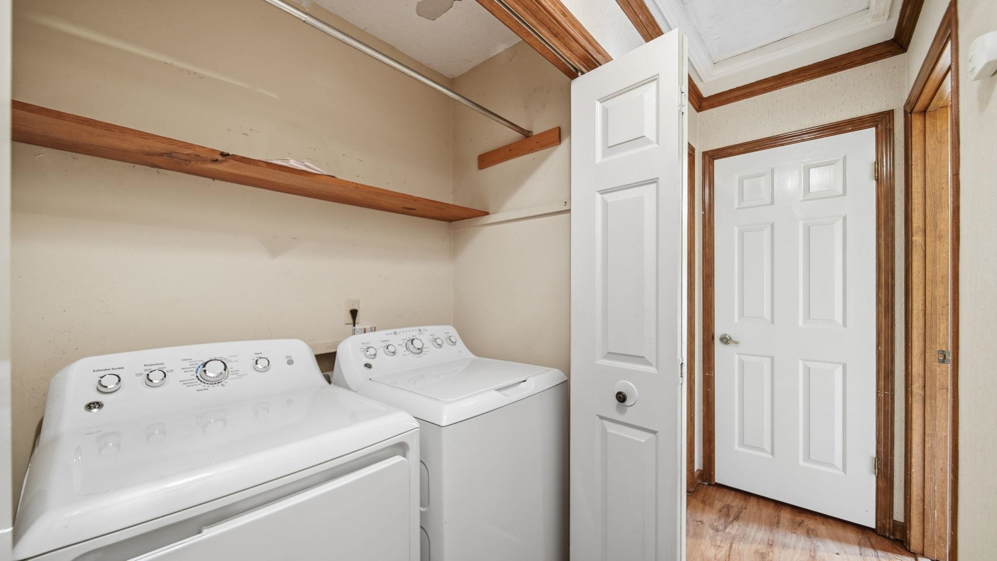 5069 Ross Road Memphis, TN 38141 - Photo 14 of 40 Washroom featuring light wood-type flooring and washing machine and clothes dryer