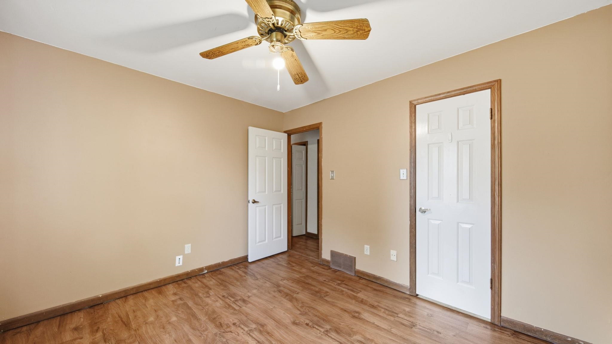 5069 Ross Road Memphis, TN 38141 - Photo 17 of 40 Unfurnished bedroom with light wood-type flooring and ceiling fan